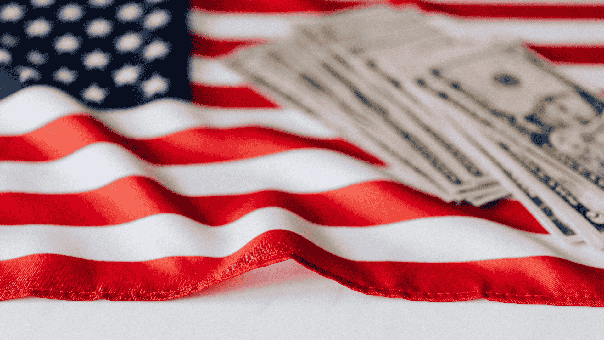 United States flag and US dollars